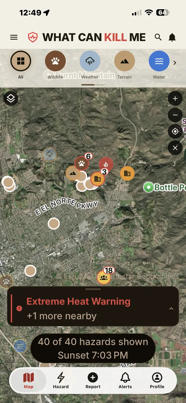 The map screen: hazard pins clustered over satellite imagery, an Extreme Heat Warning banner, and a readout saying 40 of 40 hazards shown, sunset 7:03 PM.